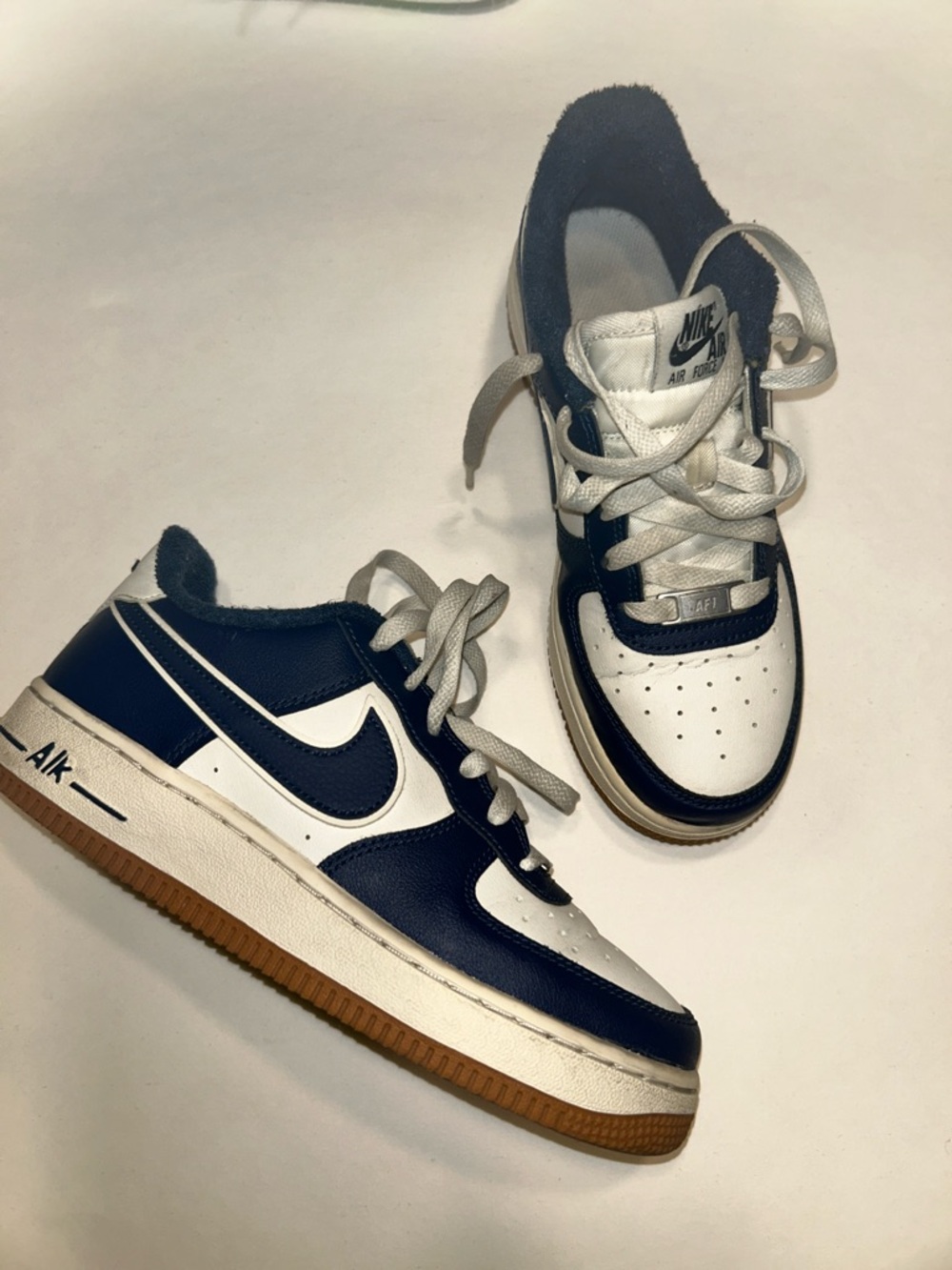 Nike Low-Top Sneakers in White and Navy with Gum Sole
